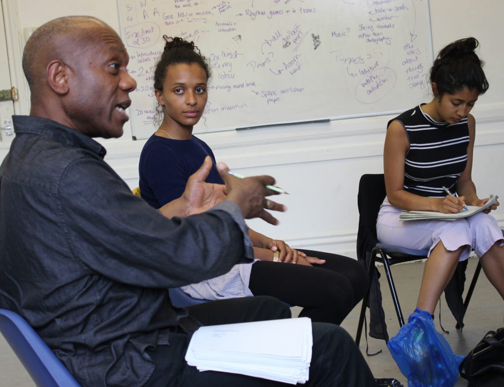 writer with scripts in workshop with actors
