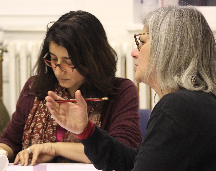 writer with scripts in workshop