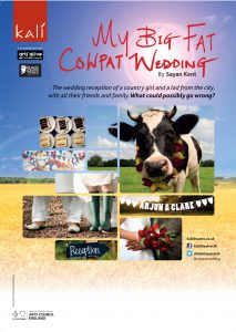 composition of cow bunting cake against country landscape