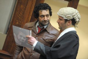 a barrister talking to a man