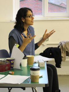 writer with scripts in workshop with actors