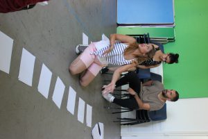 writer with scripts in workshop with actors