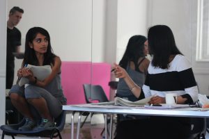 writer with scripts in workshop with actors