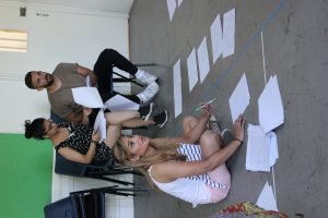 writer with scripts in workshop with actors