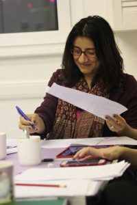 writer looking a script in a workshop