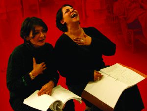 man and woman actors reading from scripts